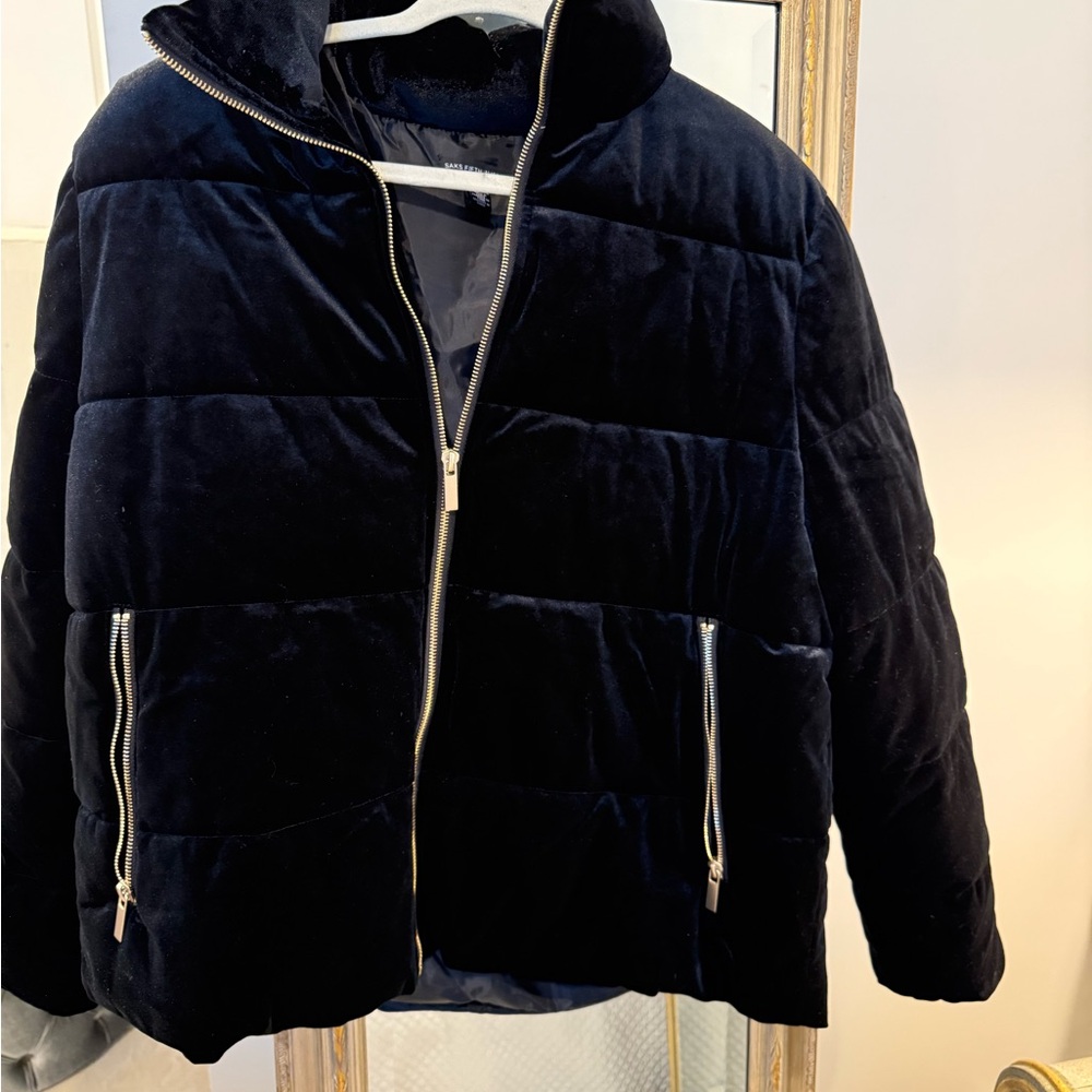 Saks Fifth Ave puffer coat with gold zippers.